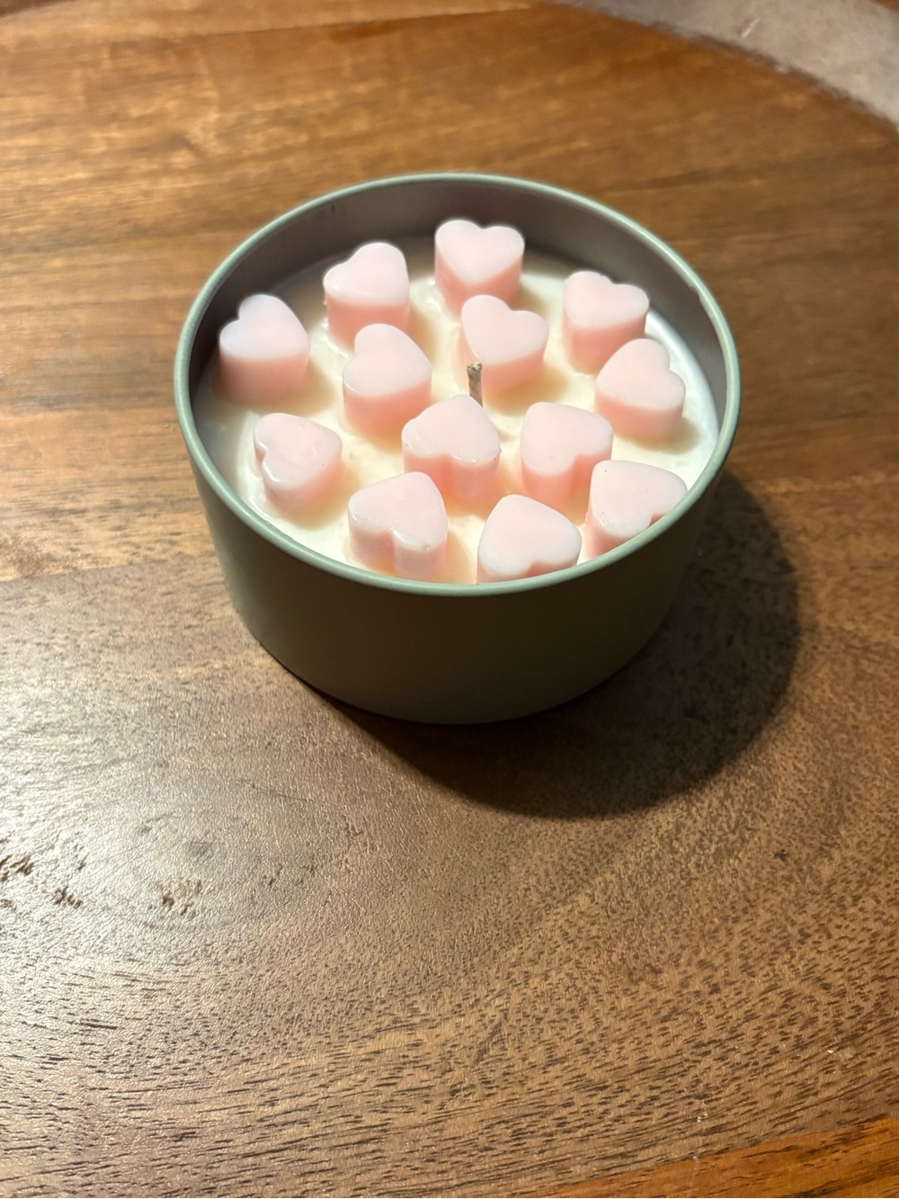 Handmade soy wax candle with heart wax melts on top
